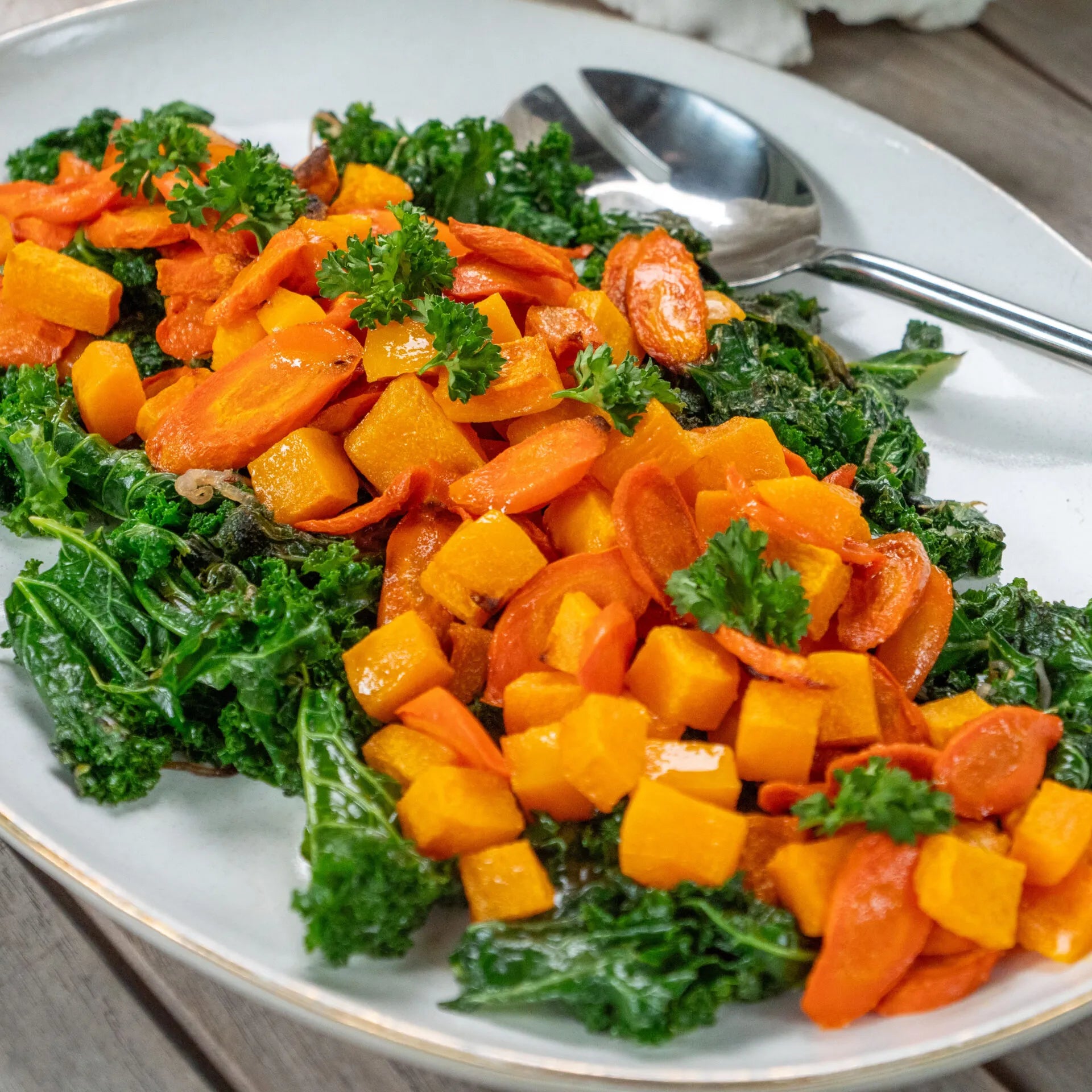 Roasted Carrots and Butternut Squash over Sauteed Kale
